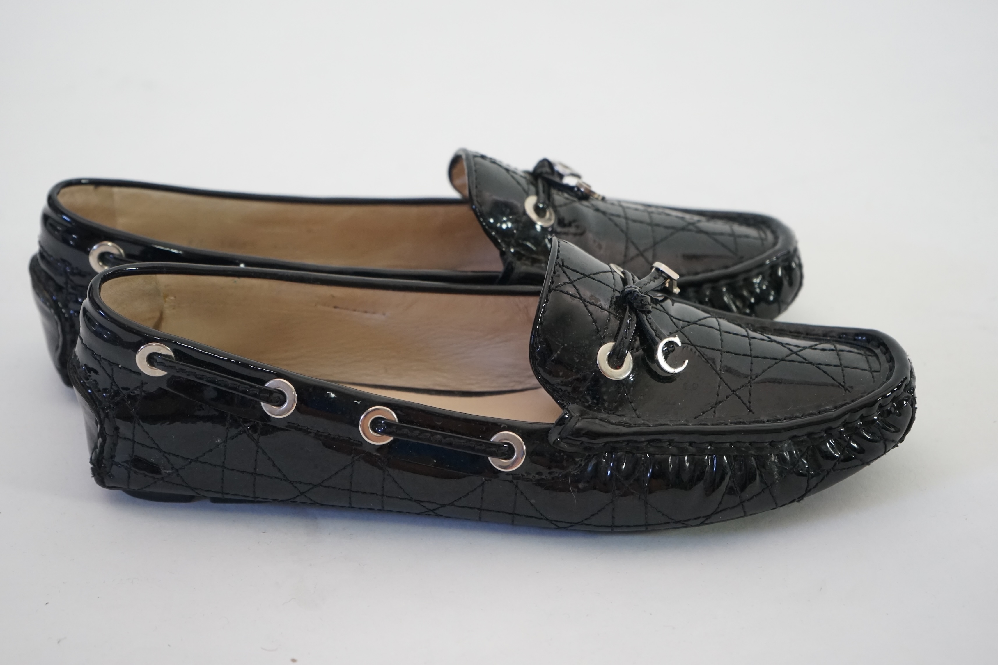 A pair of Christian Dior black patient leather lady's driving shoes with dustbag and in original box. Size 38.5. Proceeds to Happy Paws Puppy Rescue